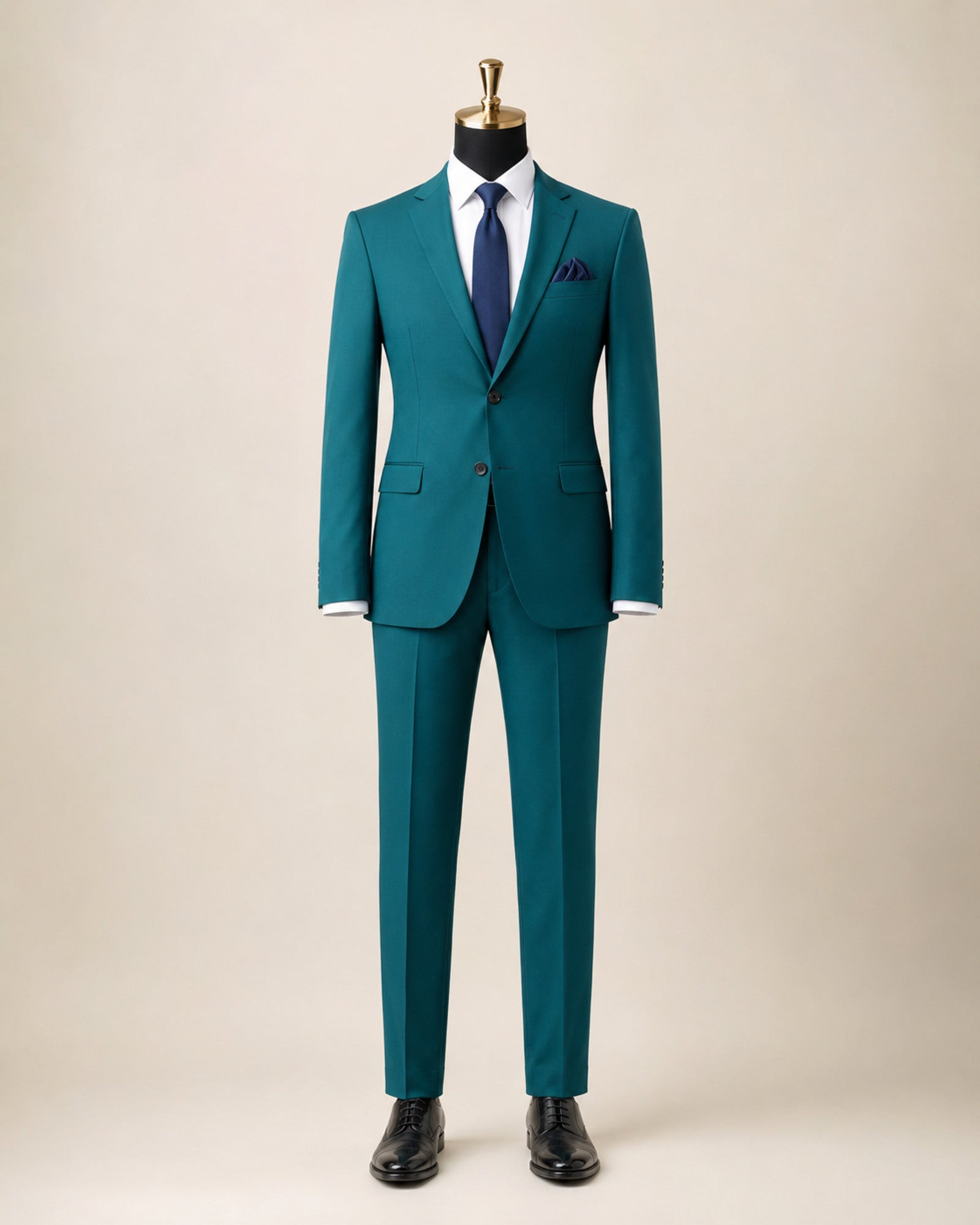 Men's teal slim fit stretch two-piece suit on black mannequin with gold top