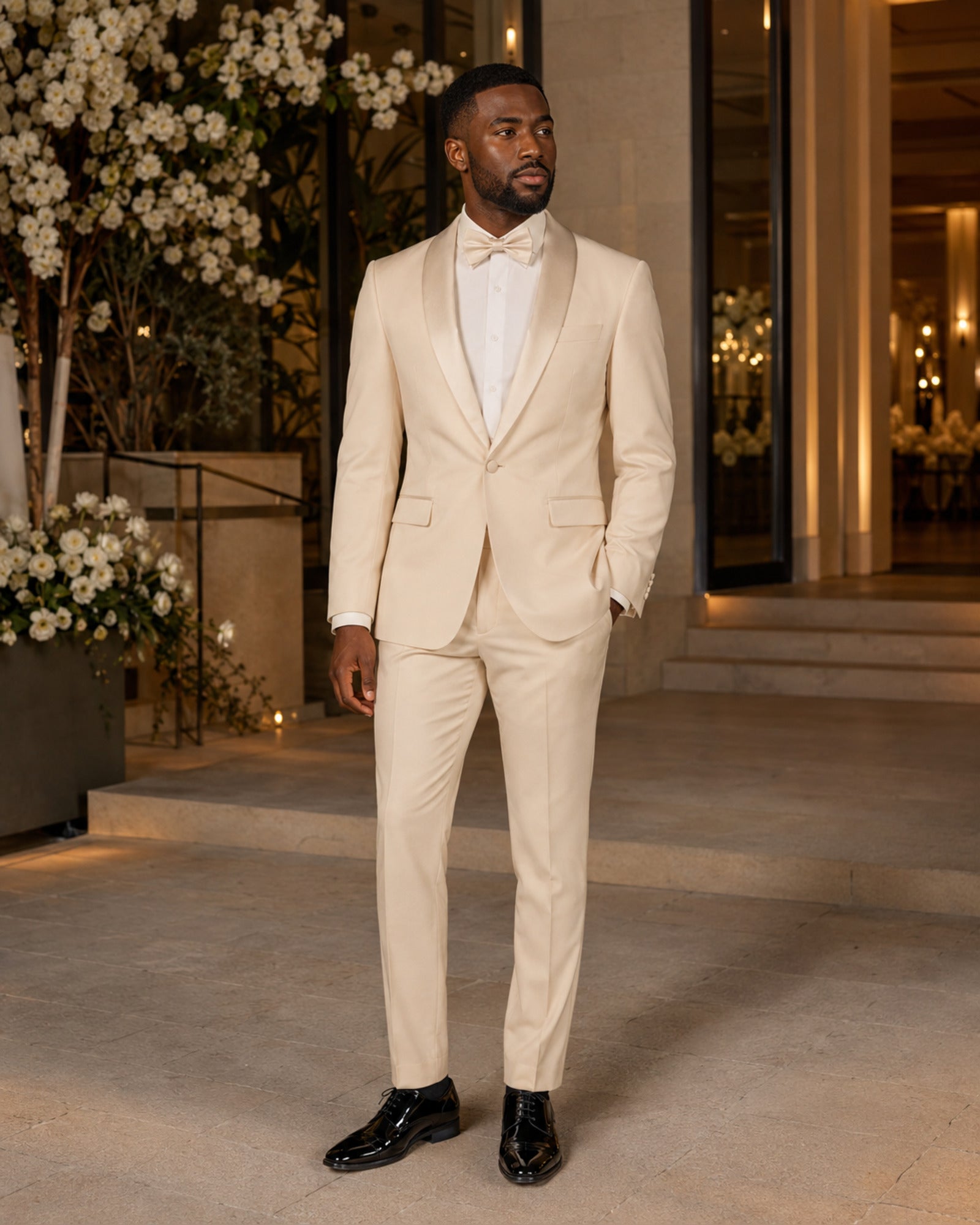 Man wearing the Champagne Beige Aurelio slim fit tuxedo at an elegant wedding venue