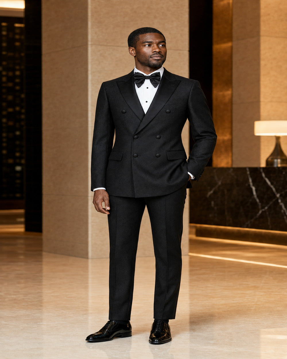 Man wearing Black Castello double-breasted tuxedo in an elegant formal setting