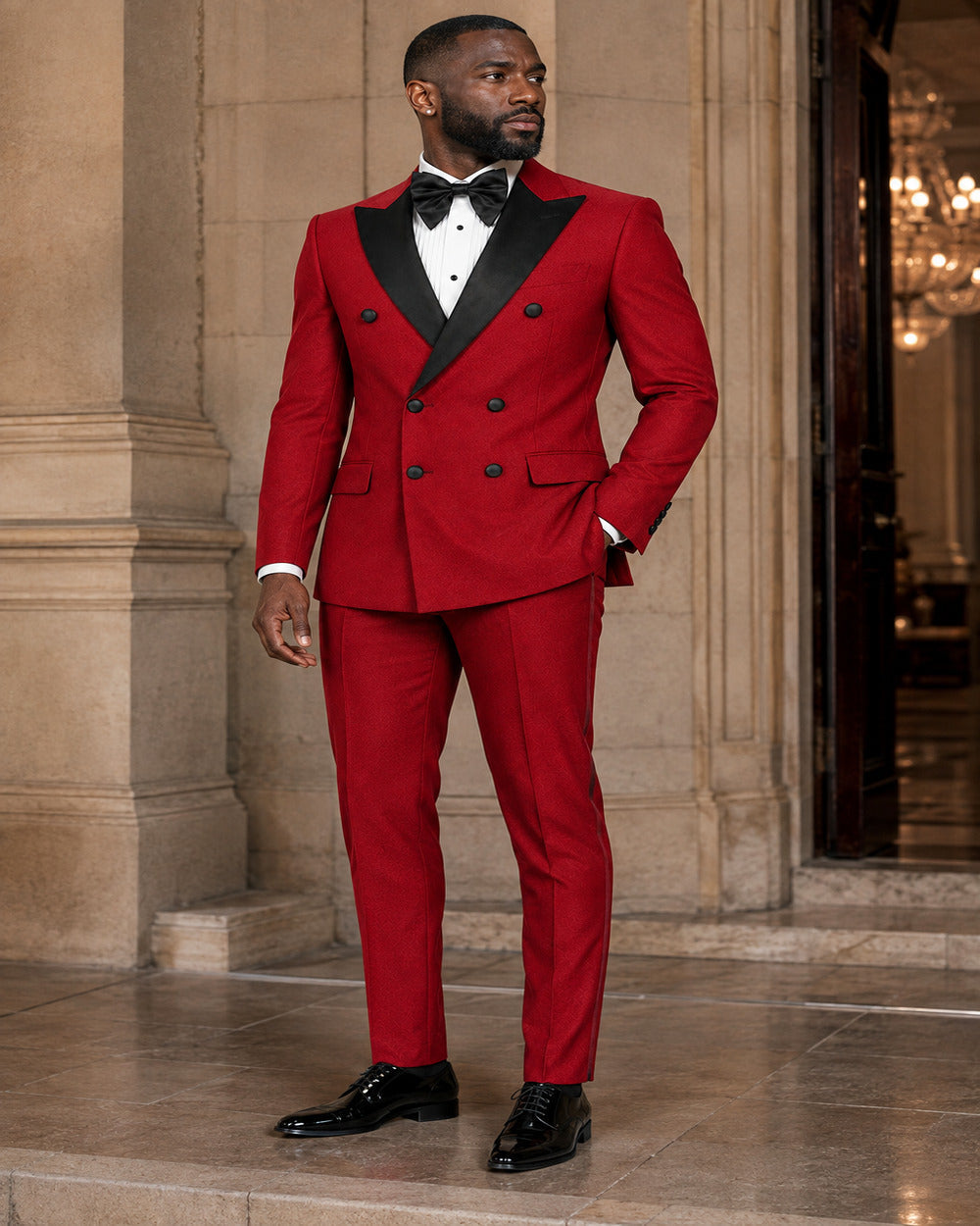 Man wearing Red Castello double-breasted tuxedo in an elegant formal setting