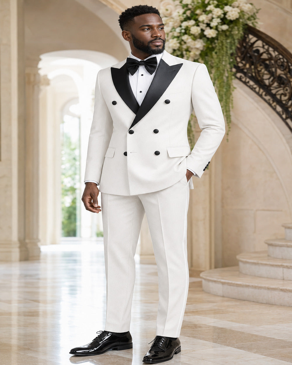 Man wearing White Castello double-breasted tuxedo in an elegant formal setting