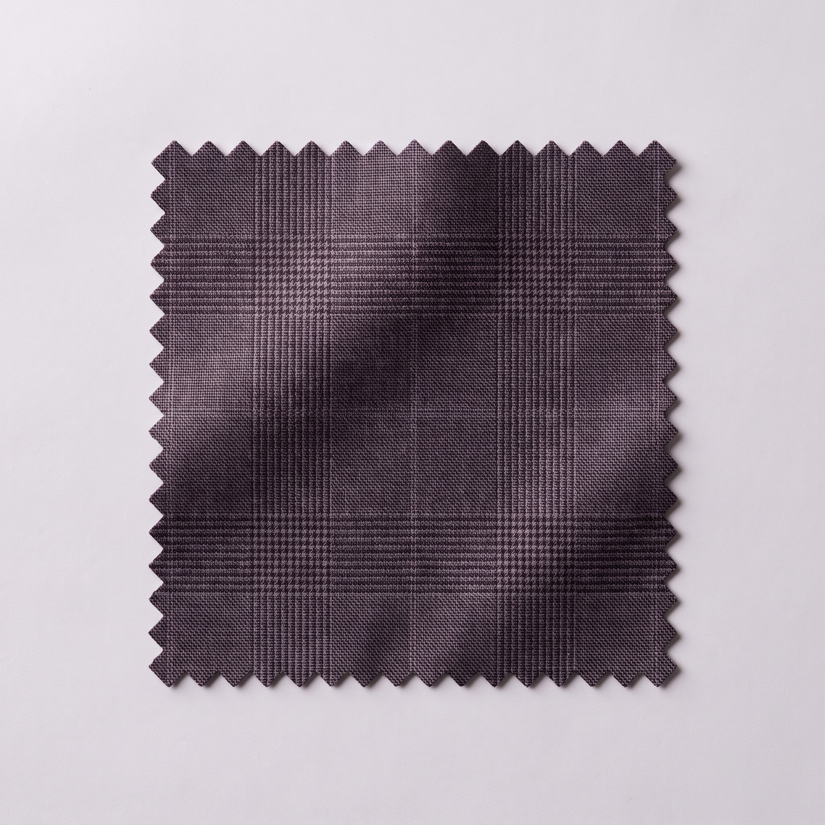 Black glen plaid suit fabric swatch close-up