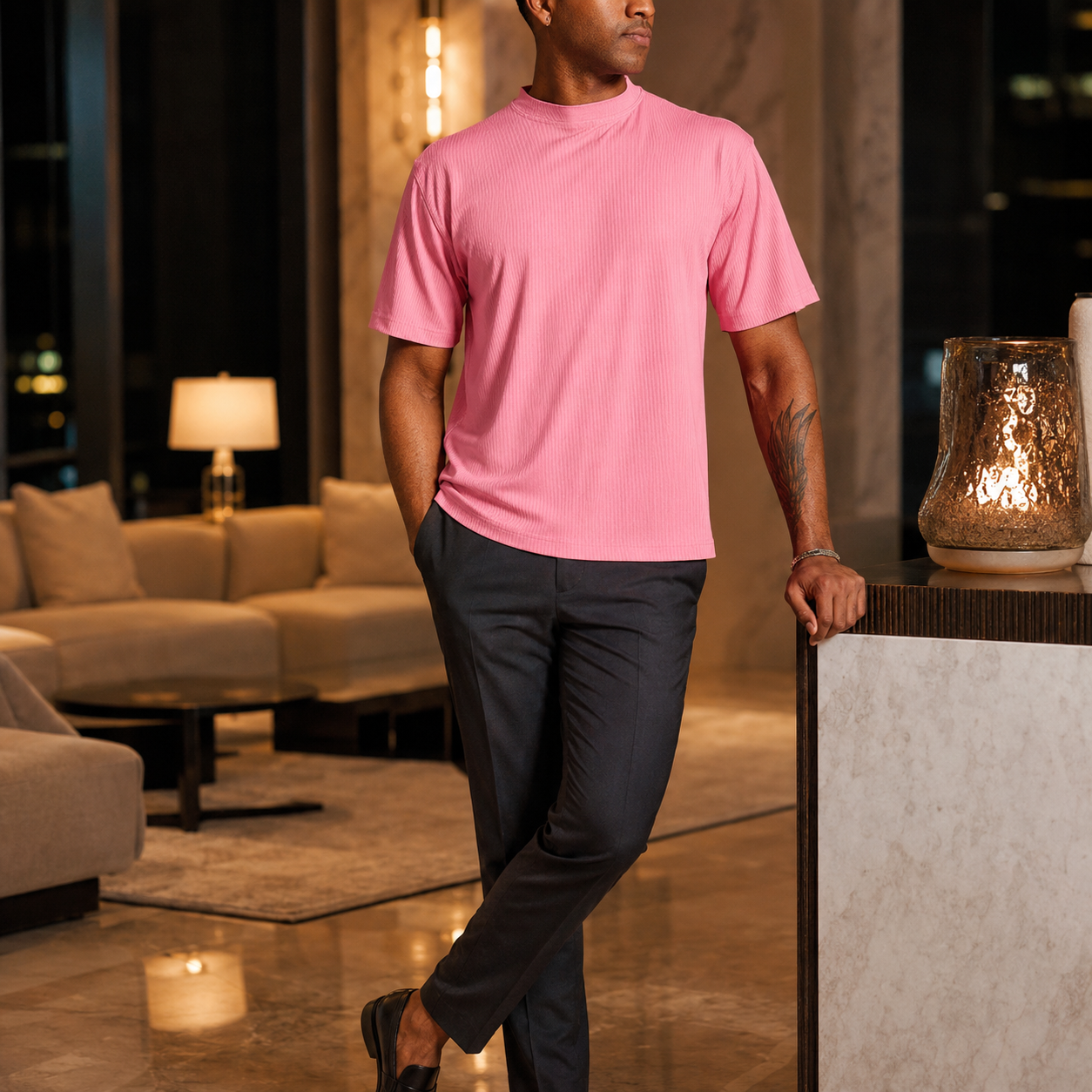 Men's summer pink ribbed crew neck T-shirt styled with charcoal pants for an evening look