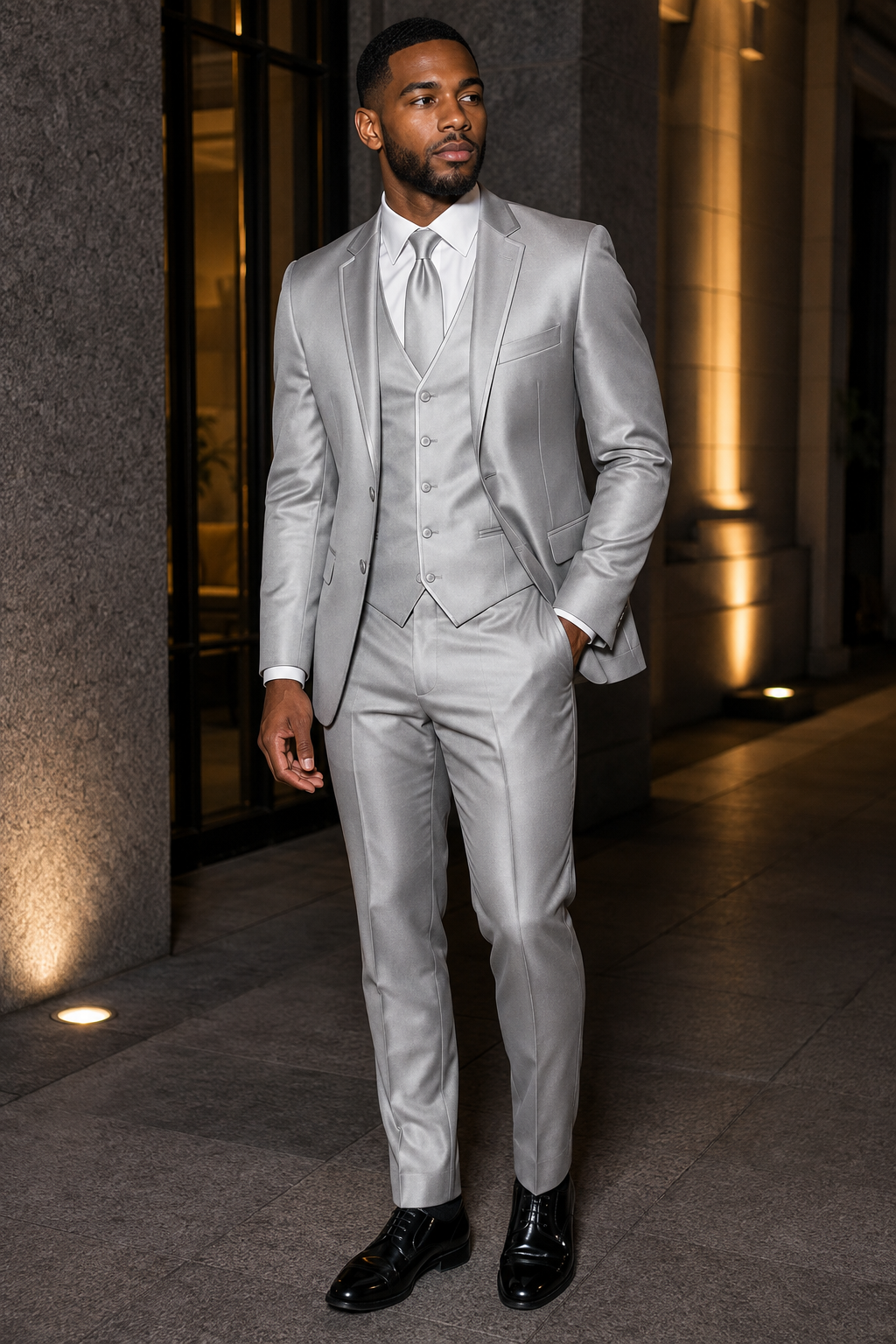 Man wearing silver slim fit three-piece satin suit with matching lapel trim at an evening event