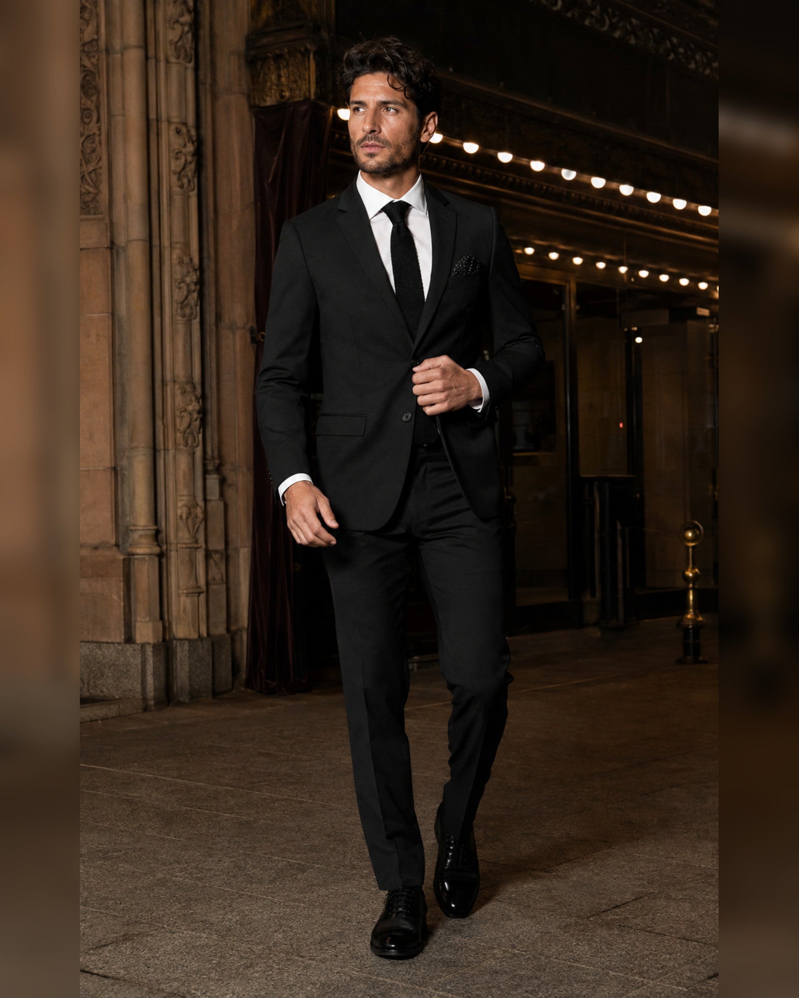 Men's black slim fit two-piece suit lifestyle