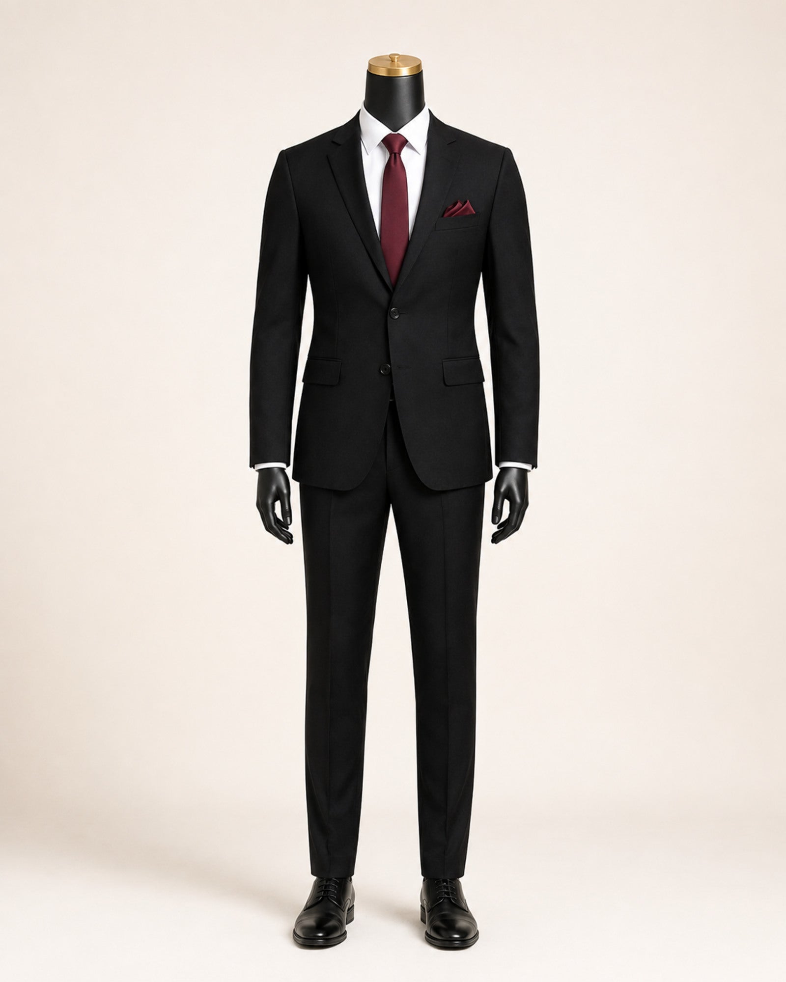 Men's black slim fit stretch two-piece suit on black mannequin with gold top