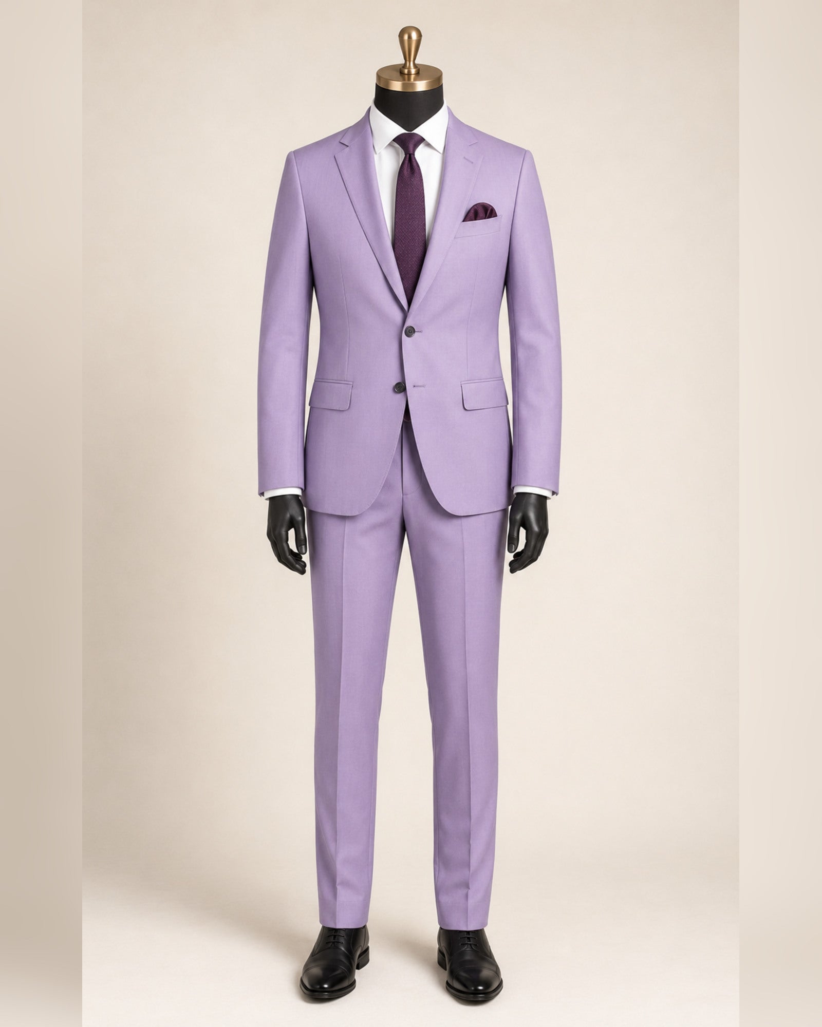 Men's lavender slim fit stretch two-piece suit on black mannequin with gold top