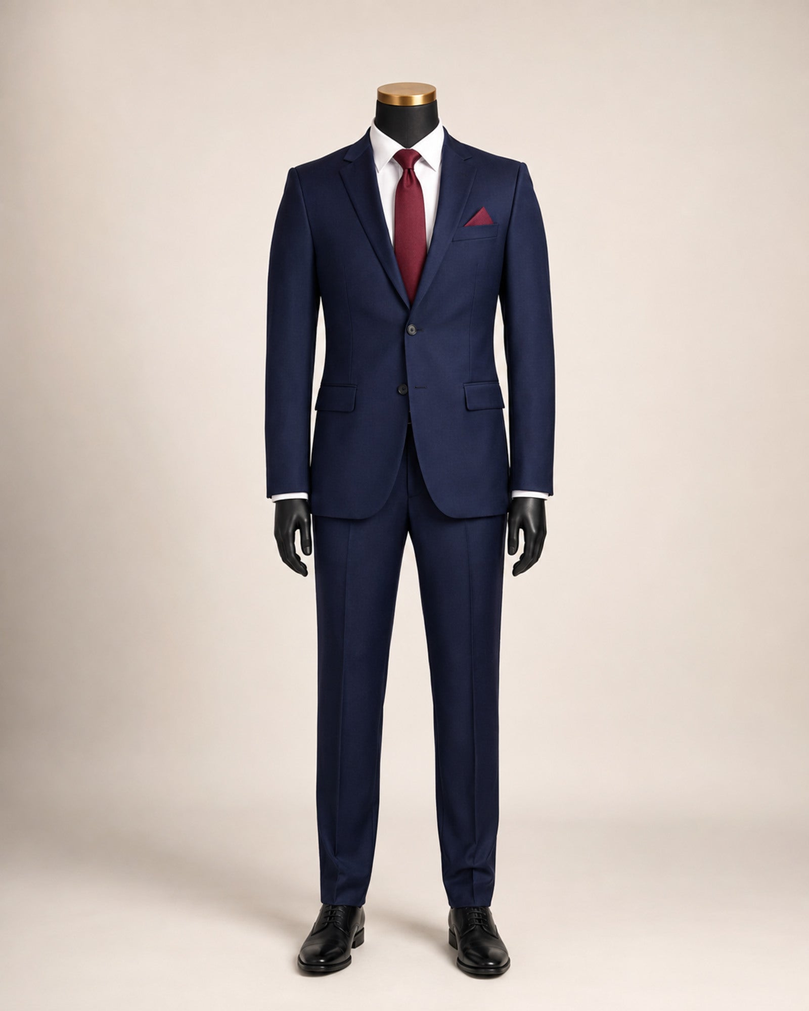 Men's navy slim fit stretch two-piece suit on black mannequin with gold top
