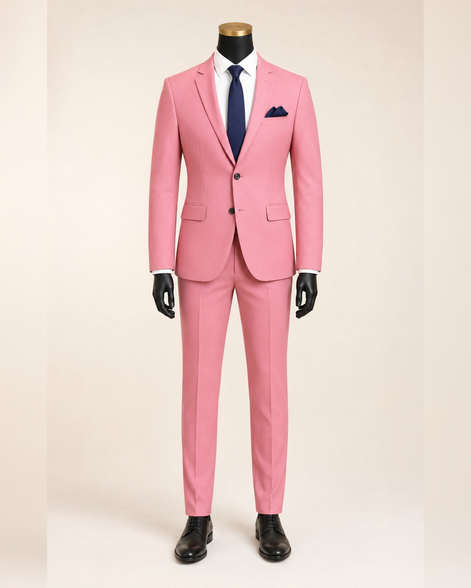 Men's pink slim fit stretch two-piece suit on black mannequin with gold top